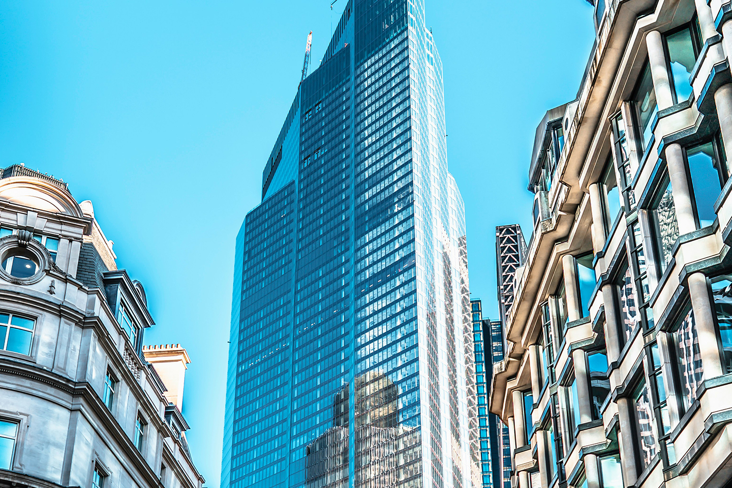 Traditional London buildings justaposed and overshawdowed by a high rise building. Developers left in the dark—Property Week