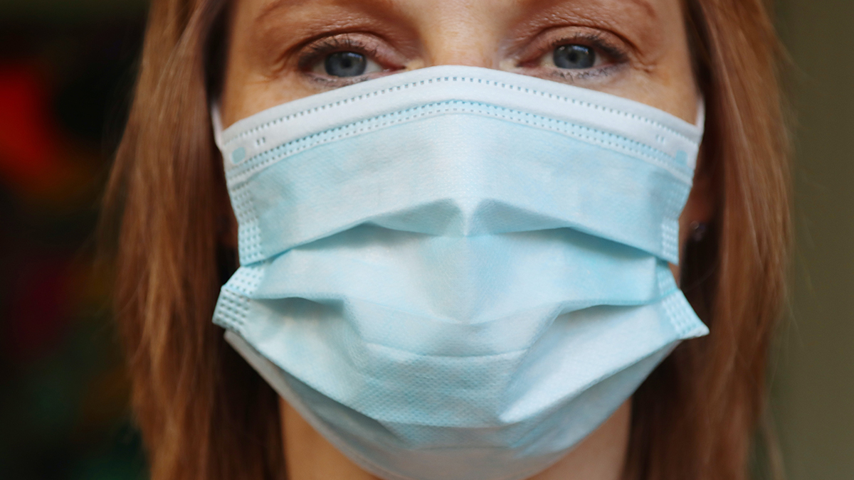 A lady wearing a surgical mask covering. Man who said wearing a mask at work was a ‘breach of the Nuremberg laws’ and linked it to slavery has tribunal claims rejected