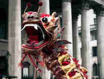 Chinese dragon parade through the streets of London. Embracing the Year of the Dragon