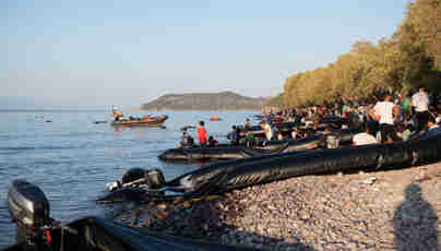 Boats on the beach in greece. Nina Stevens former search and resue in Greece Russell-Cooke solicitors news 2023