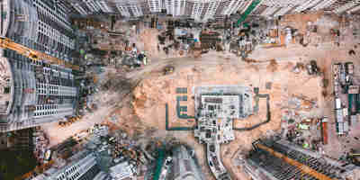 Birdseye view of construction site or land to be built on. Overage and clawback on sales of land —considerations for sellers  