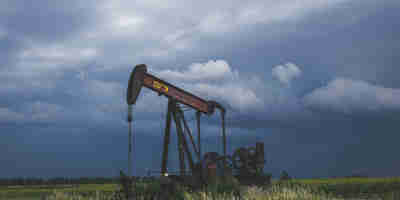 An oil field in the British countryside. -Assessing pending Supreme Court verdict in a Surrey oil field case—Property Week