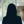 Russell-Cooke Solicitors staff photograph. Silhouette of a female team member against the backdrop of an office window and corridor with a soft focus effect.