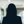Russell-Cooke Solicitors staff photograph. Silhouette of a female team member against the backdrop of an office with a soft focus effect.