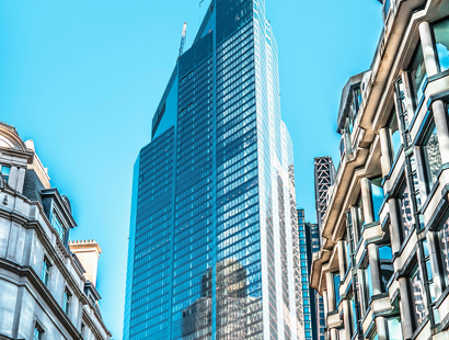Traditional London buildings justaposed and overshawdowed by a high rise building. Developers left in the dark—Property Week