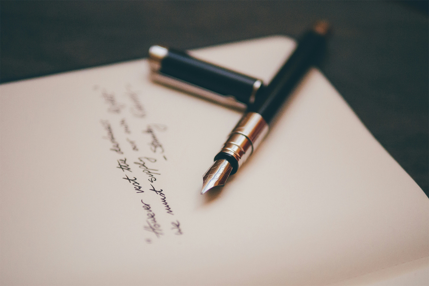 A fountain pen on a handwritten letter of wishes. Five things not to put in a will—Money Week