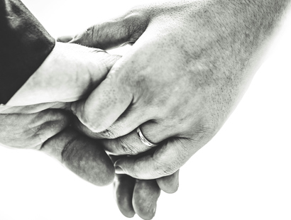 A married couple holding hands. Navigating capacity challenges