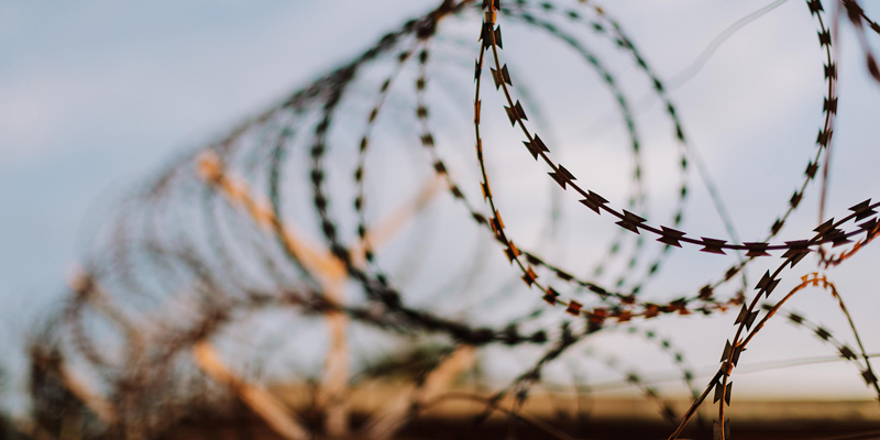 barbed-wire-prison-early-release-russell-cooke-news-2026.jpg