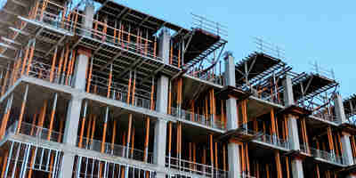 Letters of intent – how to tame the beast—Construction Law. Building under construction with heavy scaffolding. 