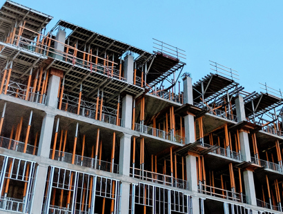 Letters of intent – how to tame the beast—Construction Law. Building under construction with heavy scaffolding. 