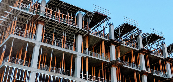 Letters of intent – how to tame the beast—Construction Law. Building under construction with heavy scaffolding. 