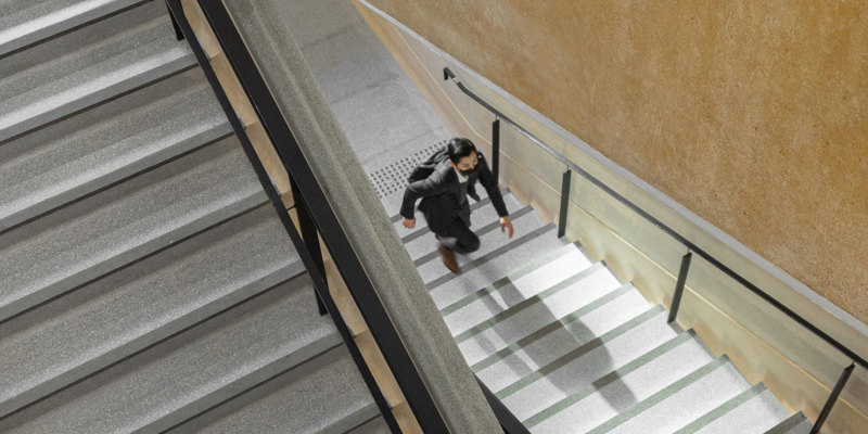 Russell-Cooke insolvency news and updates July 2023: Man walking up flight of stairs