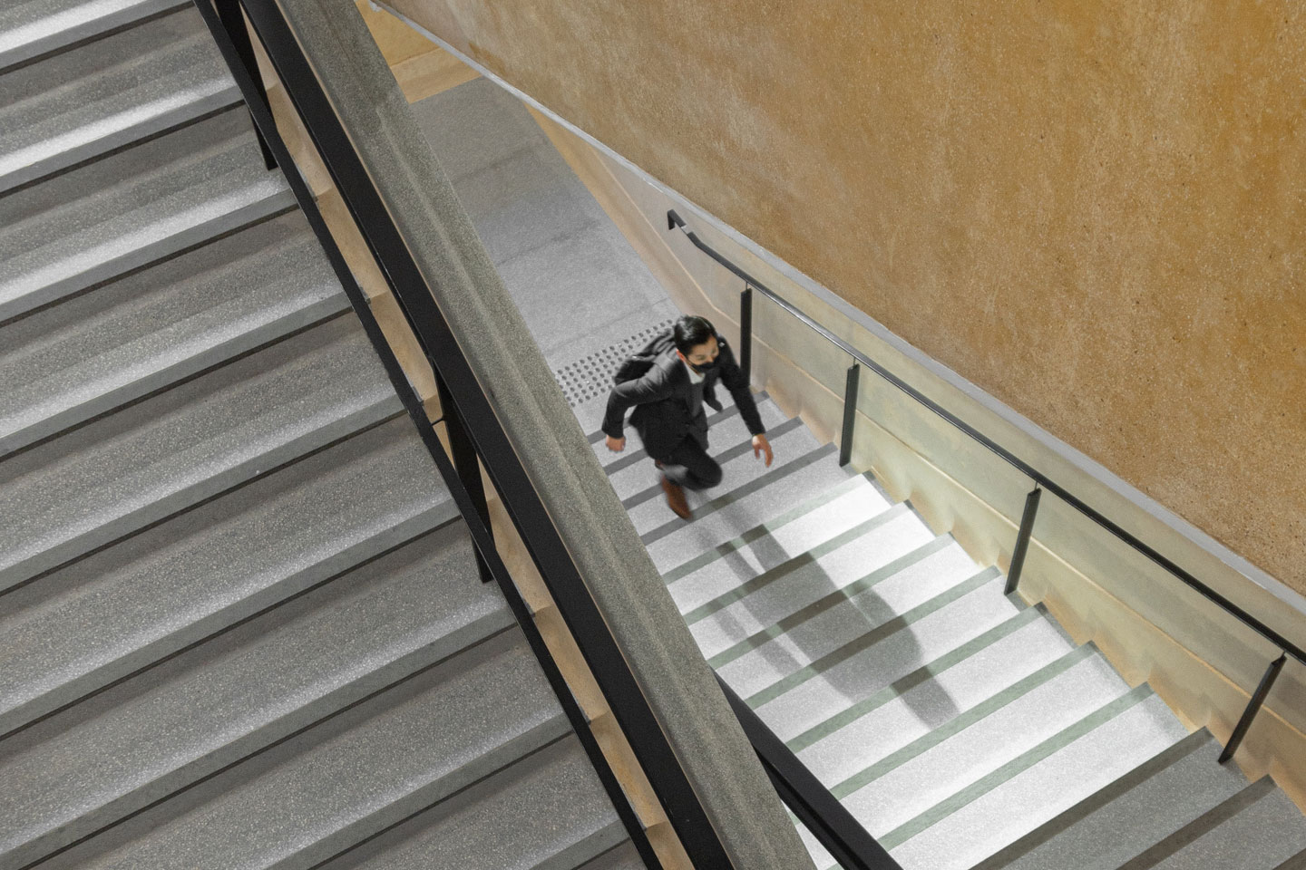 Russell-Cooke insolvency news and updates July 2023: Man walking up flight of stairs