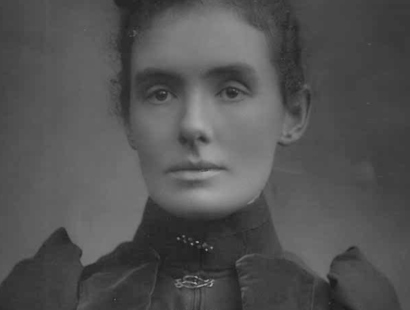 A  black and white portrait of Maye Russell Cooke, the wife of the firm's founder and an unwavering campaigner for women's rights