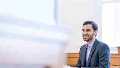 Gareth Roy, solicitor, working at desk