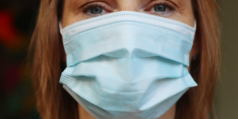 A lady wearing a surgical mask covering. Man who said wearing a mask at work was a ‘breach of the Nuremberg laws’ and linked it to slavery has tribunal claims rejected