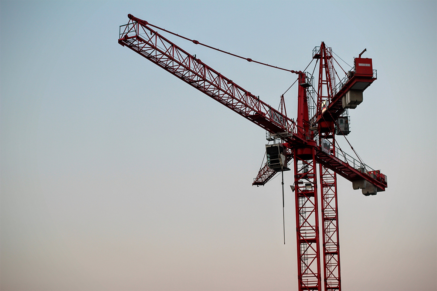red crane in blue sky. Recent CIL appeal acts as reminder that obligation to pay CIL can be triggered by demolition