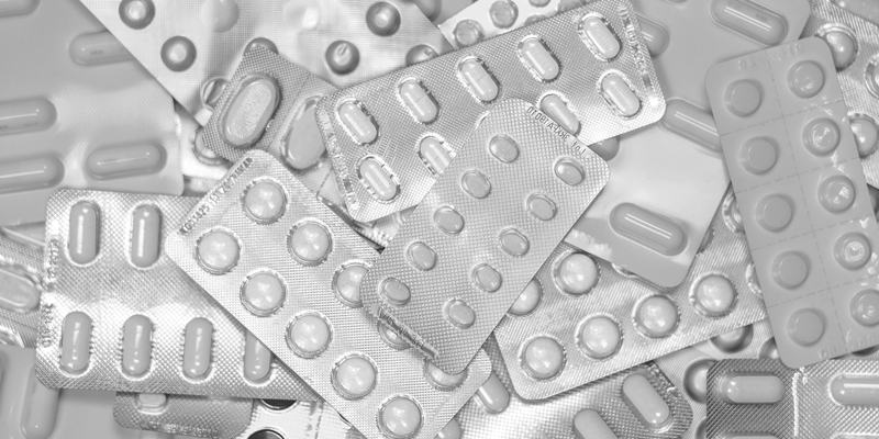 The picture shows a pile of pill packets. Russell-Cooke has advised Alissa Healthcare Research Limited on the creation of an Employee Ownership Trust (EOT)