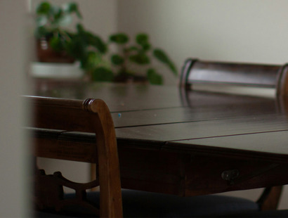 A dining room table in someone's home. Facilitating a settlement—which table and who should be seated?