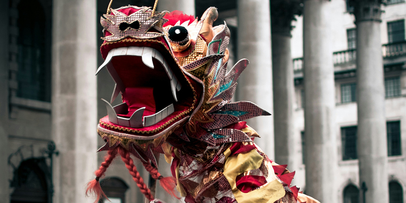 Chinese dragon parade through the streets of London. Embracing the Year of the Dragon