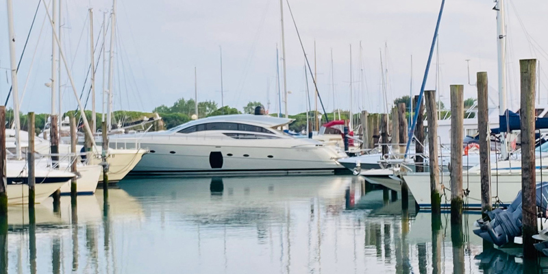 the image shows a boat in a marina