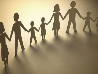 A concertina paper cut out of a male and femail family members. Playing fair—who gets what?