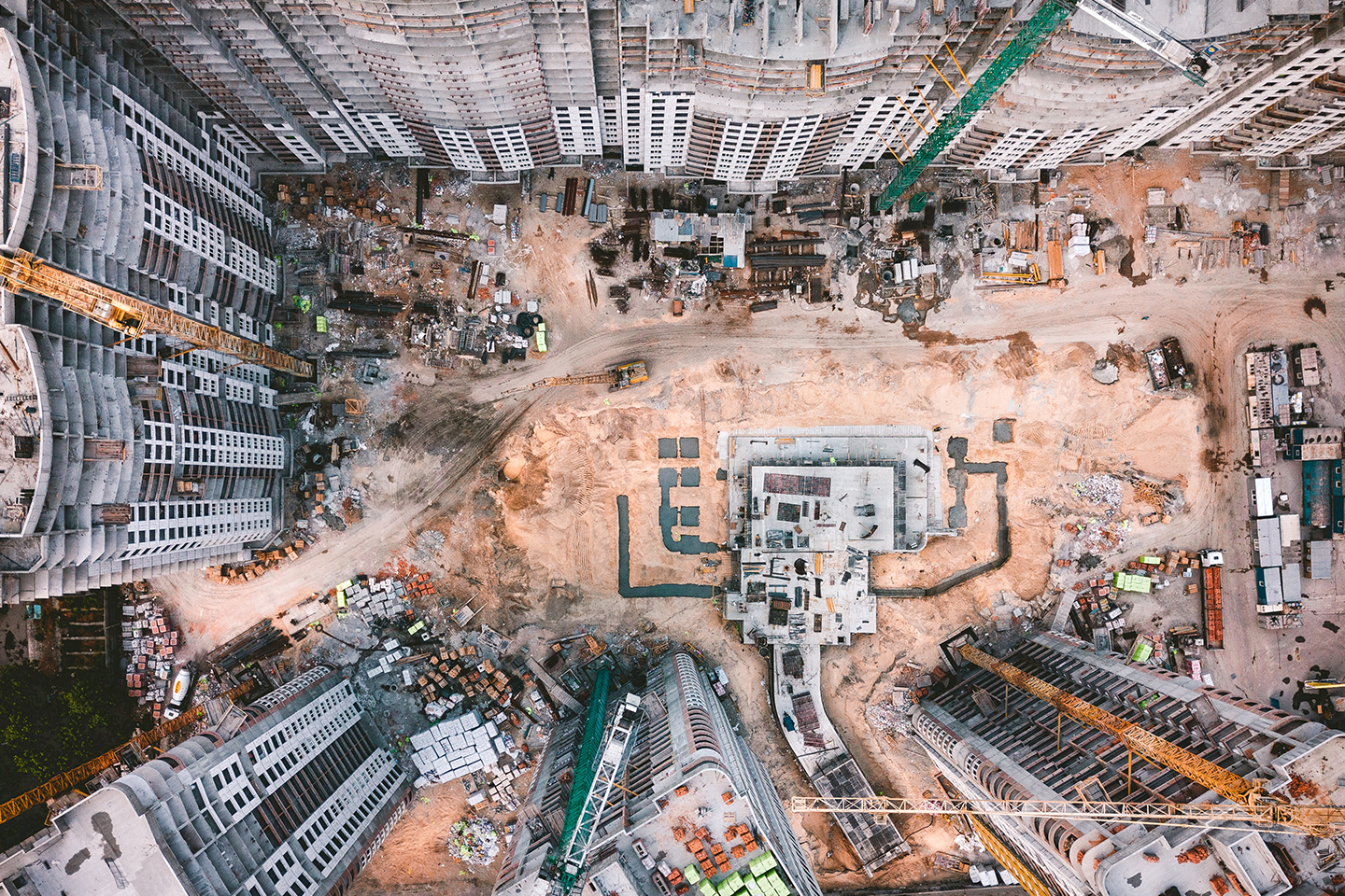 Birdseye view of construction site or land to be built on. Overage and clawback on sales of land —considerations for sellers  