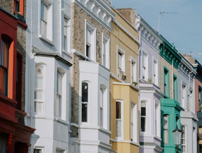Row of colourful Georgian townhouses in UK town. Disability discrimination in housing: how far does the Equality Act 2010 take us?