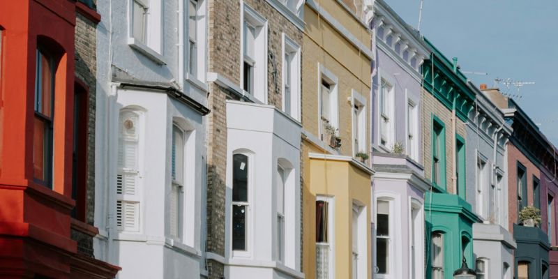 Row of colourful Georgian townhouses in UK town. Disability discrimination in housing: how far does the Equality Act 2010 take us?