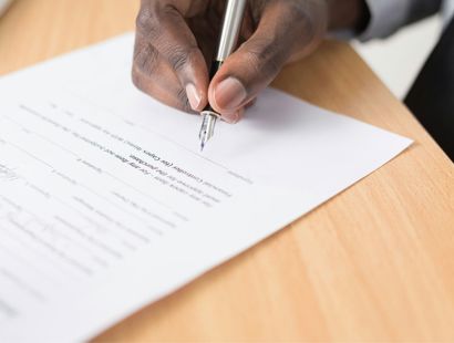 Person signing a document. Lasting Power of Attorney (LPA). Radio BBC sounds.