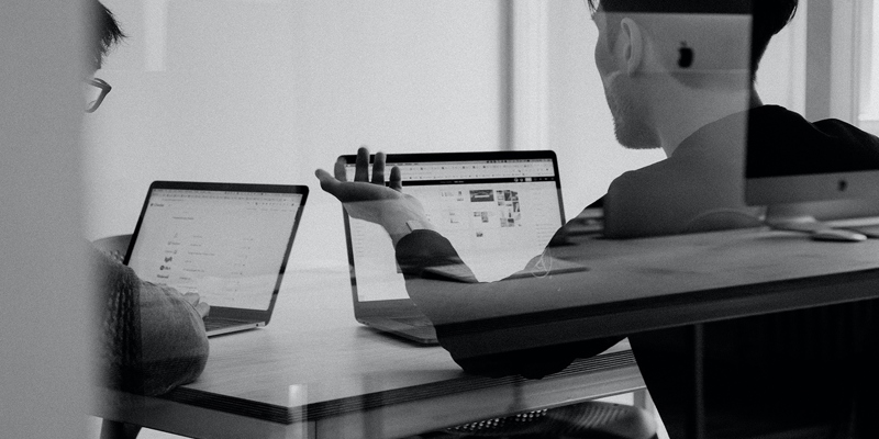 Male workers on laptops on a work desk. insights into the Future Fund, a UK government-backed scheme launched in 2020 to aid start-ups during the pandemic, as businesses approach the three-year maturity date.