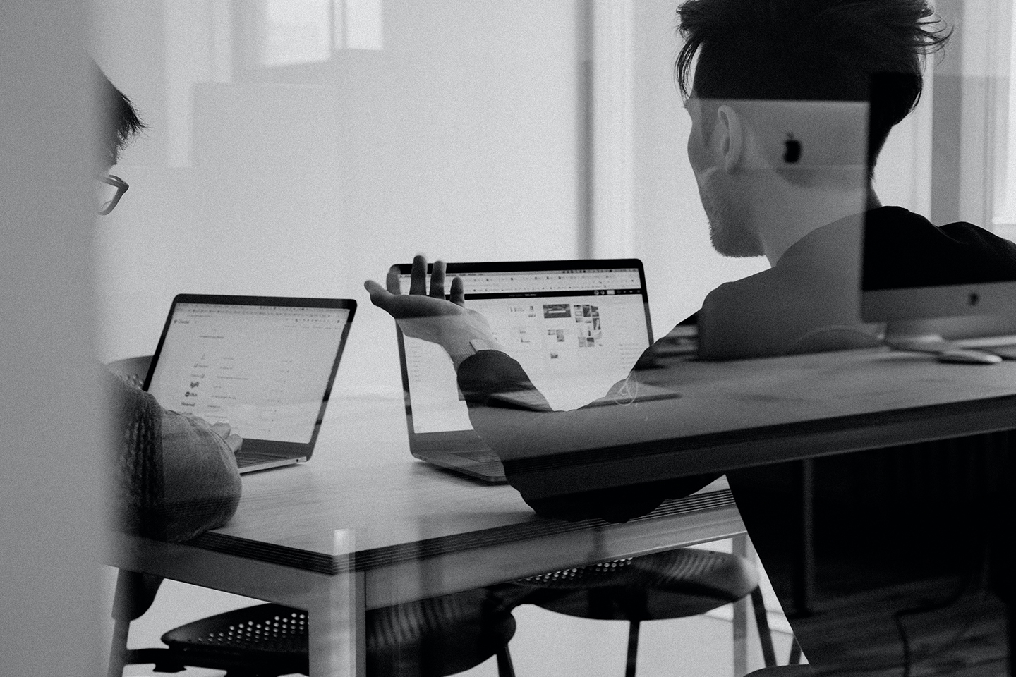 Male workers on laptops on a work desk. insights into the Future Fund, a UK government-backed scheme launched in 2020 to aid start-ups during the pandemic, as businesses approach the three-year maturity date.