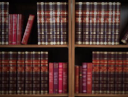 Law books stacked on a shelf. Family Procedure Rules.