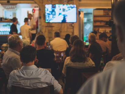British pub and people watching sports on television. Sky Business in the protection of their branding and Intellectual Property Rights