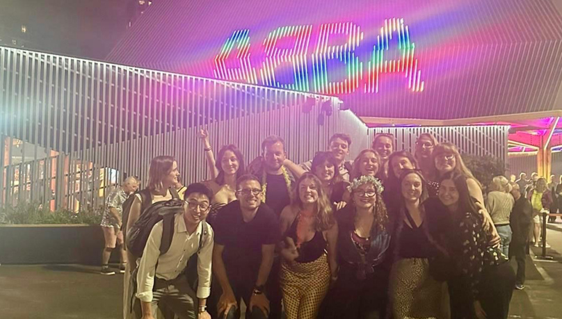 A group of young men and women outside the Abba Voyage venue. 