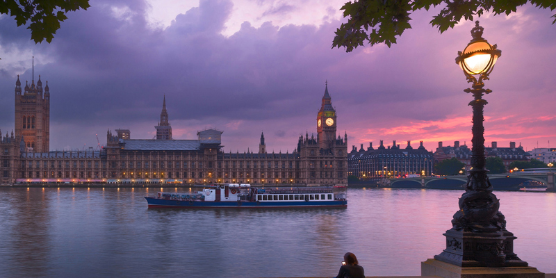 The Houses of Parliament at dusk from across the River Thames. Spring Budget—a closer look at the proposed reforms for non-domiciled UK residents
