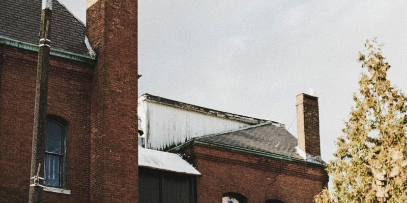 old redbrick building in city with seagull in sky. Leasehold and Freehold Reform Act 2024 (LAFRA)