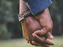 Spouses holding hands. Important changes for UK spouse visas. 