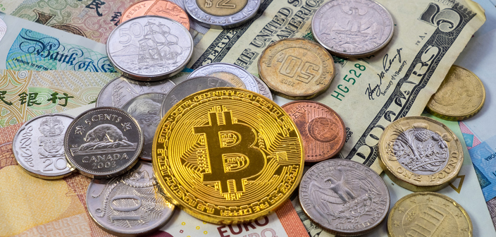 An array of fiat currencies including Euros, Dollars, Pound Sterling alongside a Bitcoin representative coin. Financial crime solicitors.