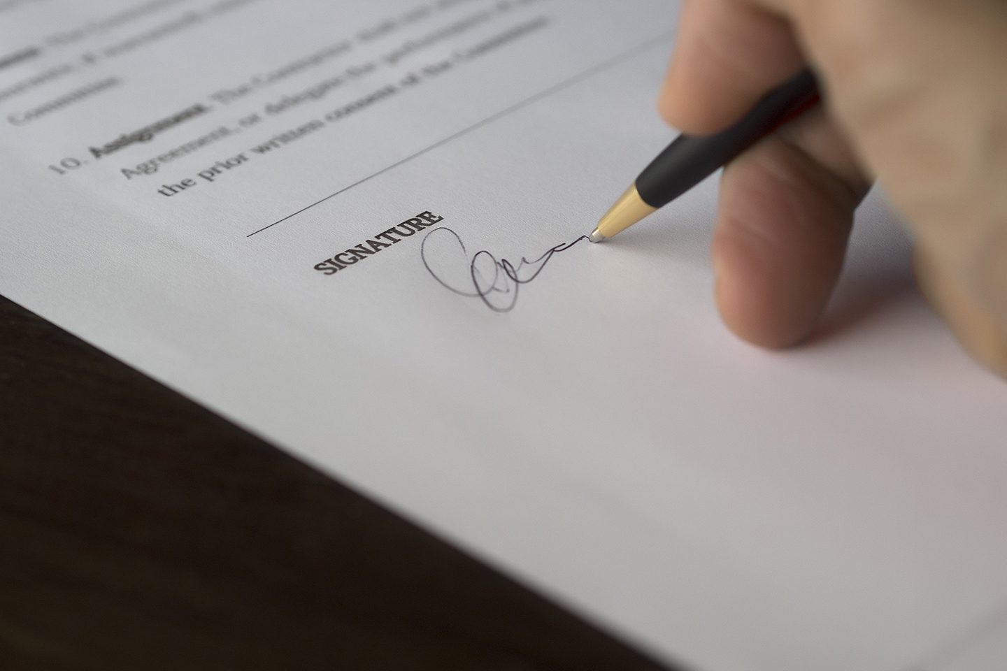 A person signing legal documentation. LPAs—stepping into the digital age with changes afoot 