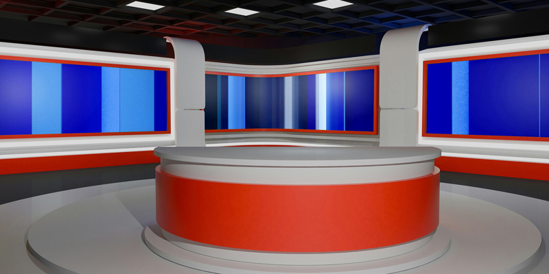 an empty news boradcasting studio with a newsdesk and a blue screen behind. Russell-Cooke advises on CNBC’s new lease at 10 Fleet Place in central London