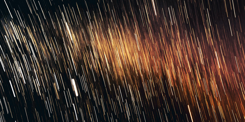 The image is an abstract image of sparks and fumes 