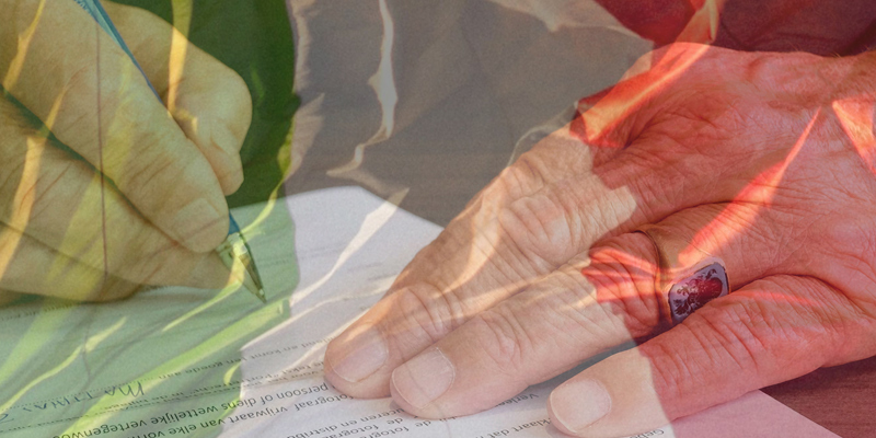 A person's hand signing paperwork with the Italian flag overlay. Powers of Attorney across borders: ensuring your LPA stands up abroad