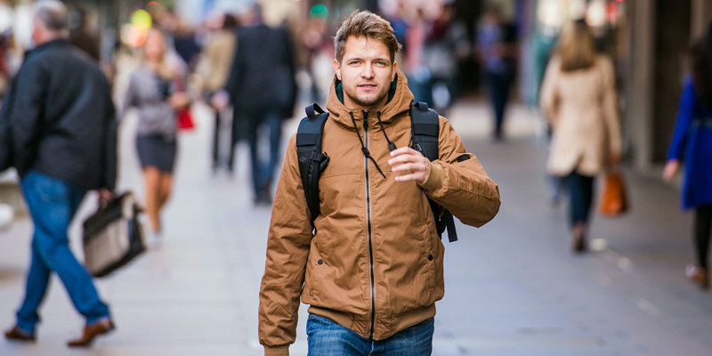 University student walking through high street. Russell-Cooke family and children law solicitors